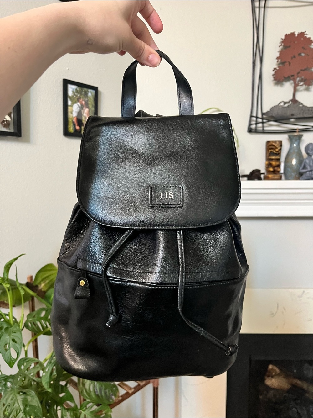JJs House Black Leather Drawstring Flap Backpack